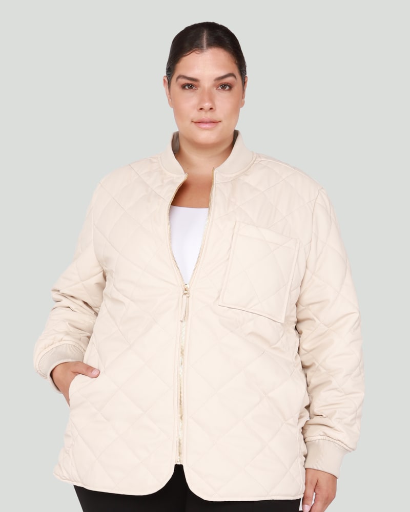 Front of a model wearing a size 1X Olivia Quilted Bomber Jacket in Light Putty by DEX PLUS. | dia_product_style_image_id:260589